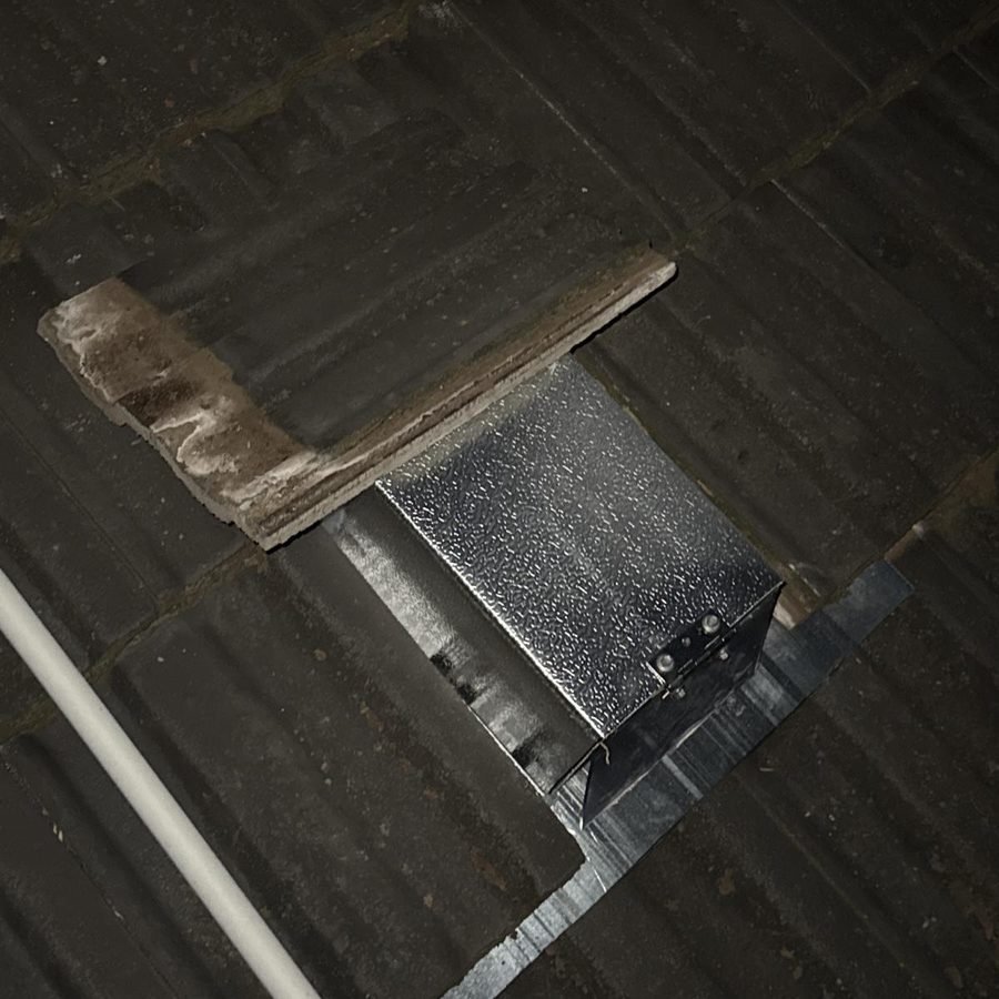 One-way possum door installed on a tiled roof